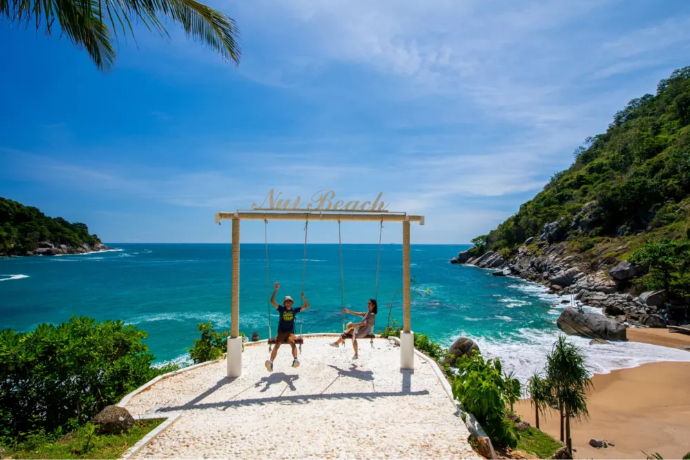 travellers swinging at Rock Swing Beach